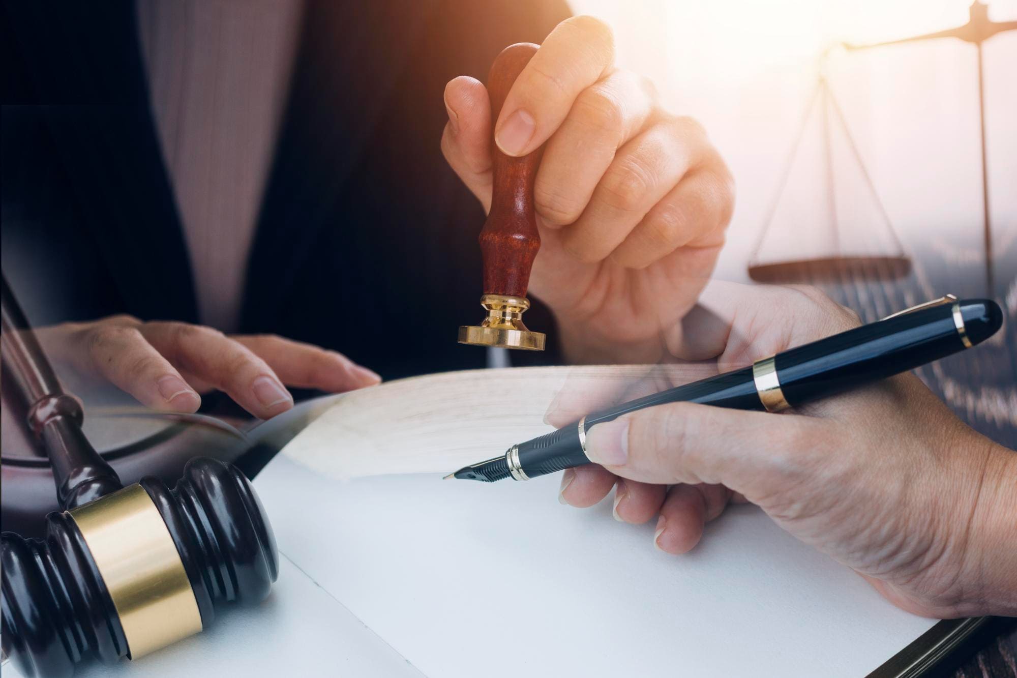 Notary stamp and fountain pen on an insurance document
